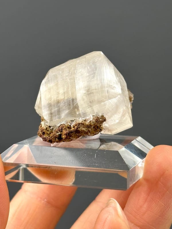 Side view of calcite on matrix, 1.5×1×1 in, Hunan