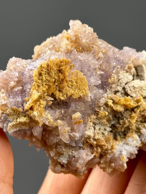 Close-up of translucent purple gypsum crystals showing pearly luster