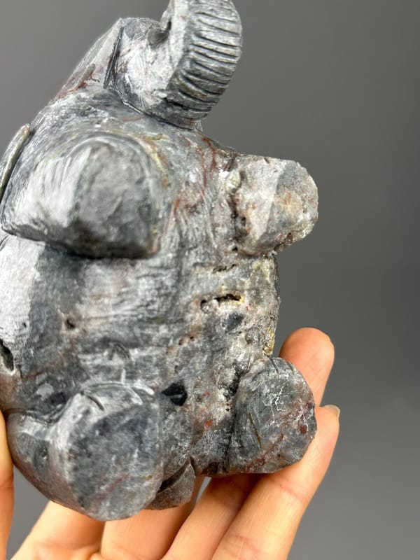 Carved garnet elephant with ruler scale reference