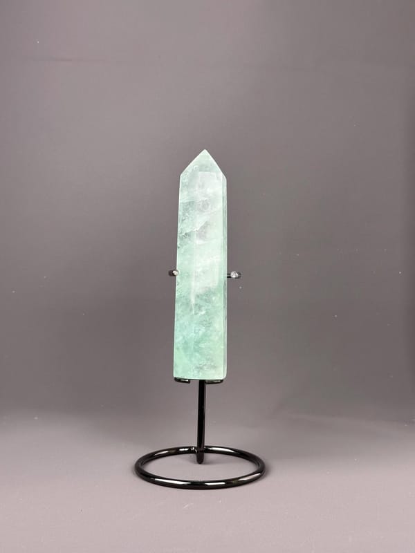 Side view of polished green fluorite obelisk tower