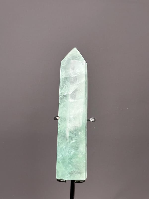 Base of polished green fluorite tower specimen