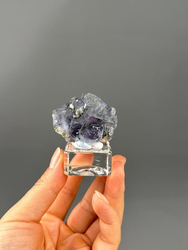 Deep purple and green hue interplay fluorite close-up