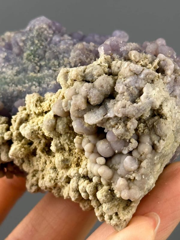 Grape agate cluster under studio lighting