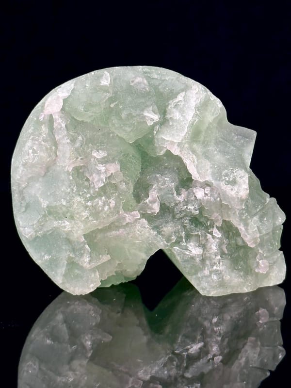 Angled view showing fluorite skull geode and interior