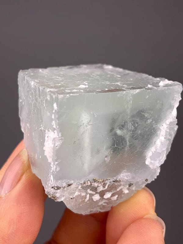 Blue UV-reactive fluorite crystal with calcite inclusions, Yaogangxian Mine, Hunan