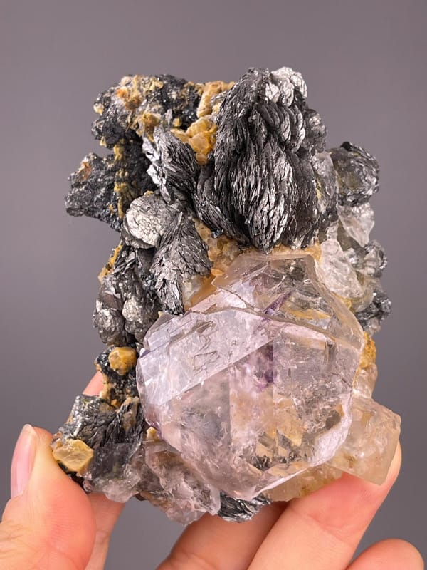 Fluorite with purple phantoms and marcasite blades from Inner Mongolia