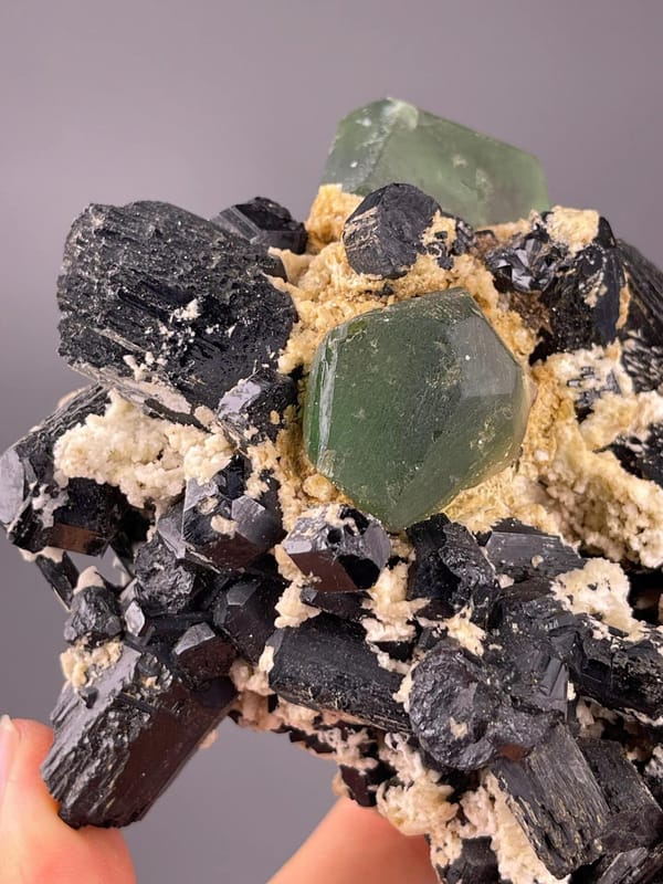 Tourmaline and fluorite cluster measuring 5.0×3.3×3.5 inches