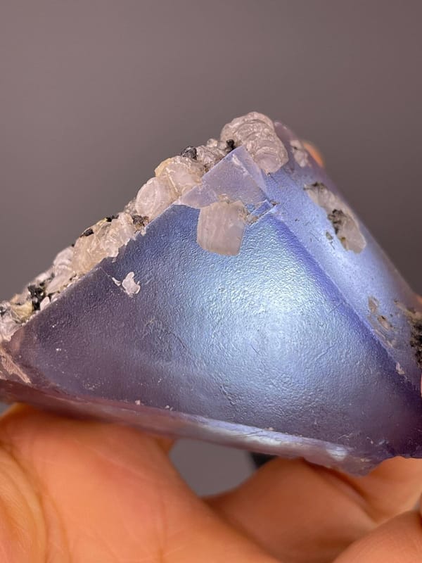 Purple fluorite triangular crystal with calcite, China