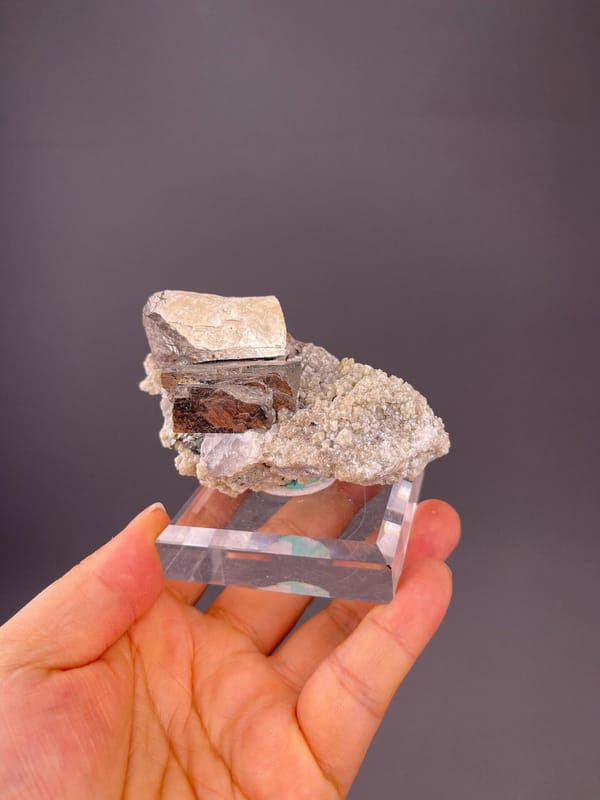 Brassy iridescent chalcopyrite covering white quartz matrix