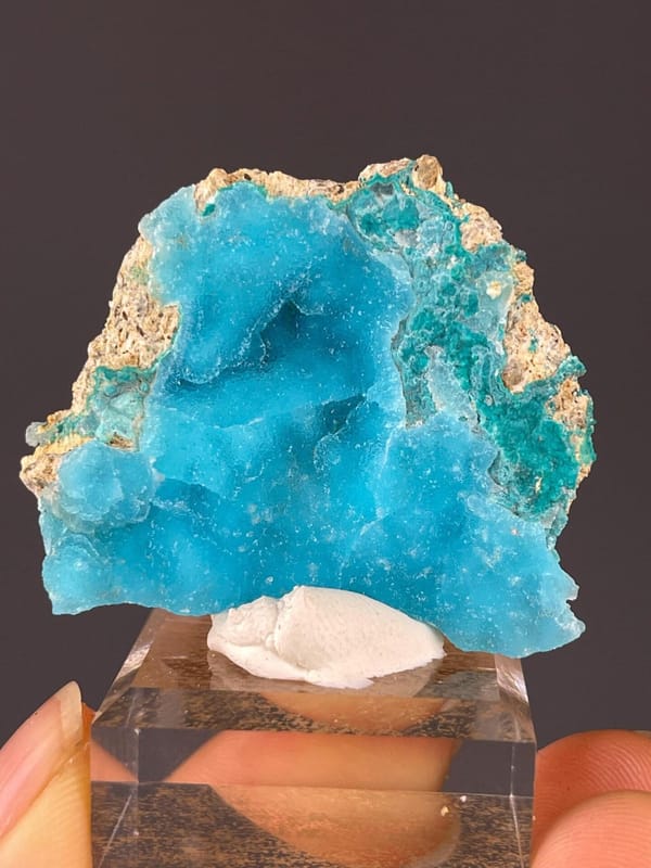 Hemimorphite Zn4Si2O7 crystal beside pink calcite, China