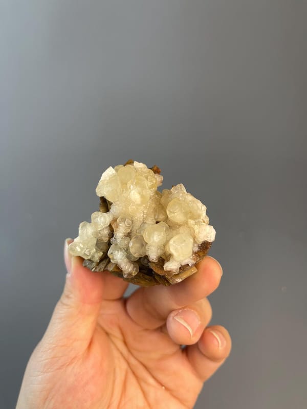 Rounded calcite sphere with unusual droplet habit, China