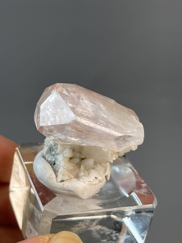 Pink calcite crystal displaying vitreous luster