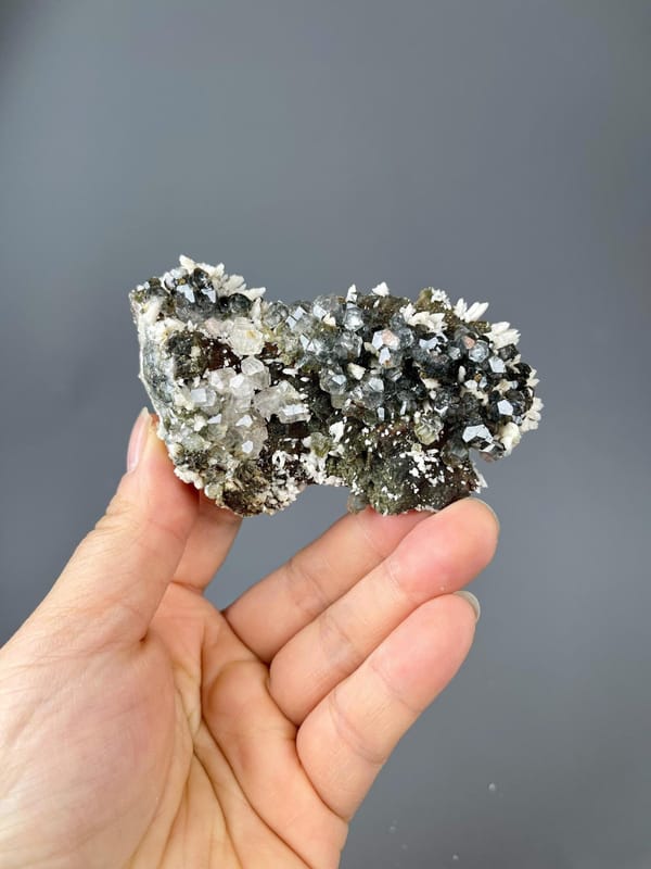 White dolomite crystals hosting calcite with copper, Morocco