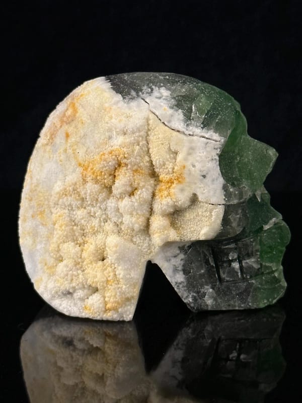 Mineral art: green fluorite skull with geode hollow interior