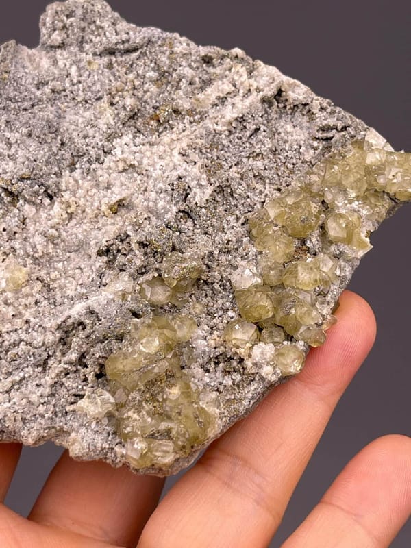 Angled view of yellow calcite crystal cluster