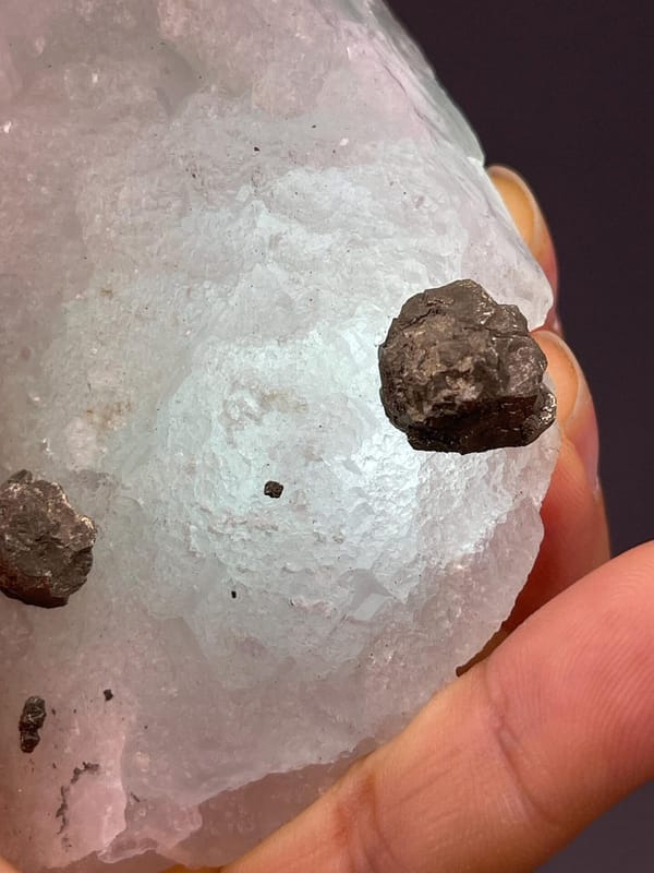 Metallic iron ore nodules in green fluorite matrix