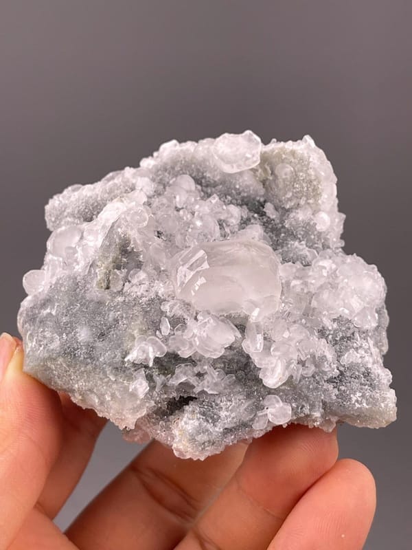Front view of pink mangano calcite cluster from Peru