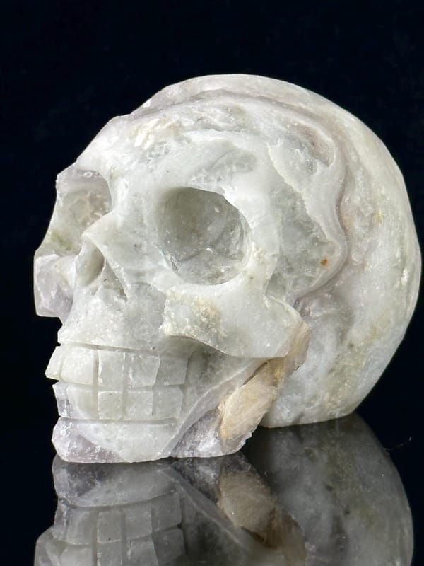 Front view of hand-carved fluorite skull with pyrite inclusions
