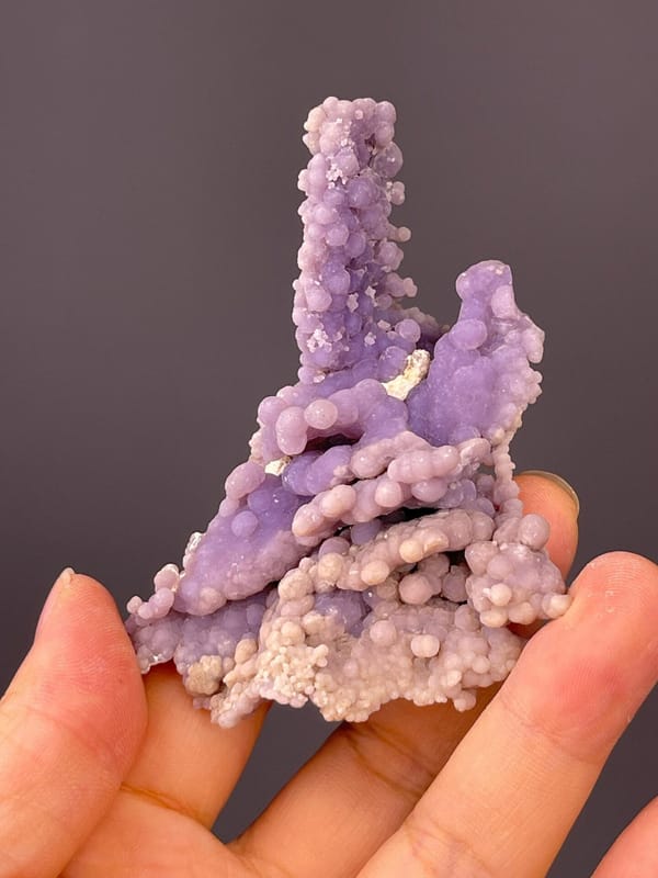 Side view of purple grape agate cluster