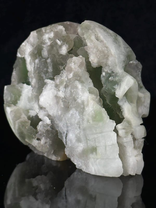 Close-up of green fluorite mineral texture on skull face