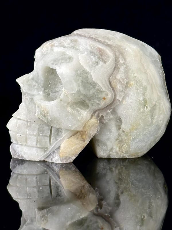 Three-quarter angle of fluorite skull with metallic inclusions
