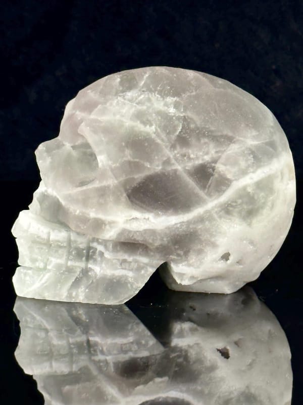 Raw quartz geode interior of fluorite skull