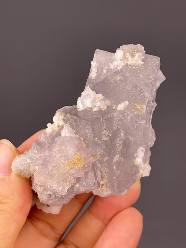 Pale green fluorite visible beneath quartz overgrowth