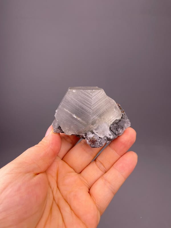 Vitreous luster on etched calcite crystal face