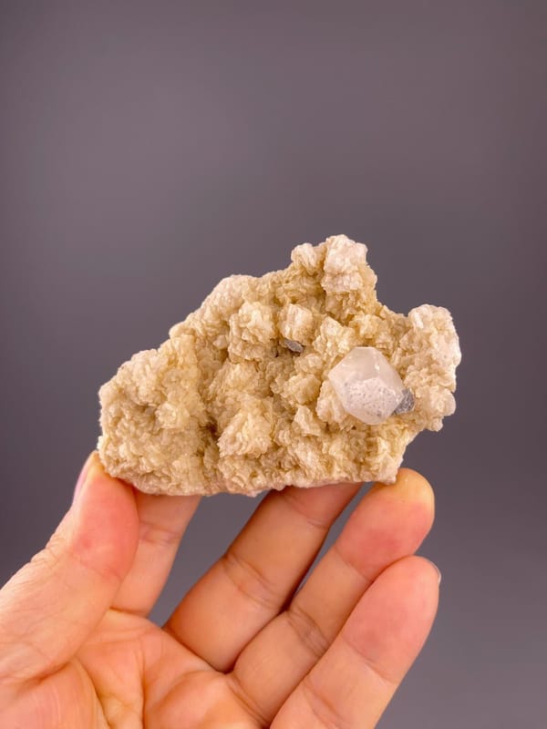 Front view of clear fluorite on dolomite matrix, 3.1×0.7×2 in