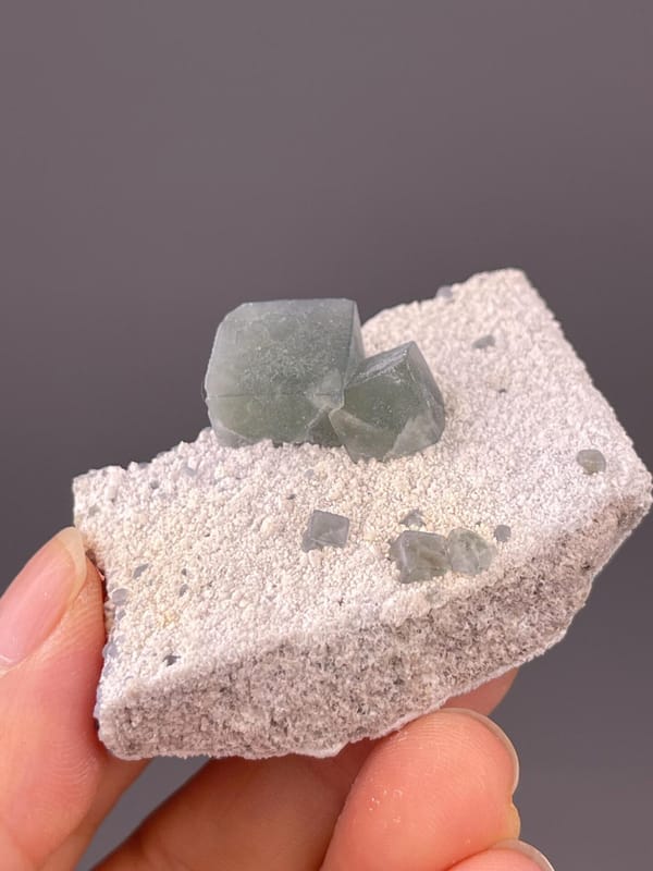 Side view of green fluorite on sandy matrix, Inner Mongolia