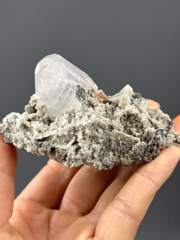Side view of calcite specimen showing transparent crystals