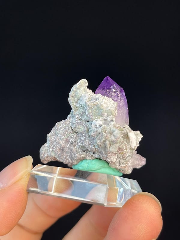 Amethyst crystal cluster displaying vitreous luster
