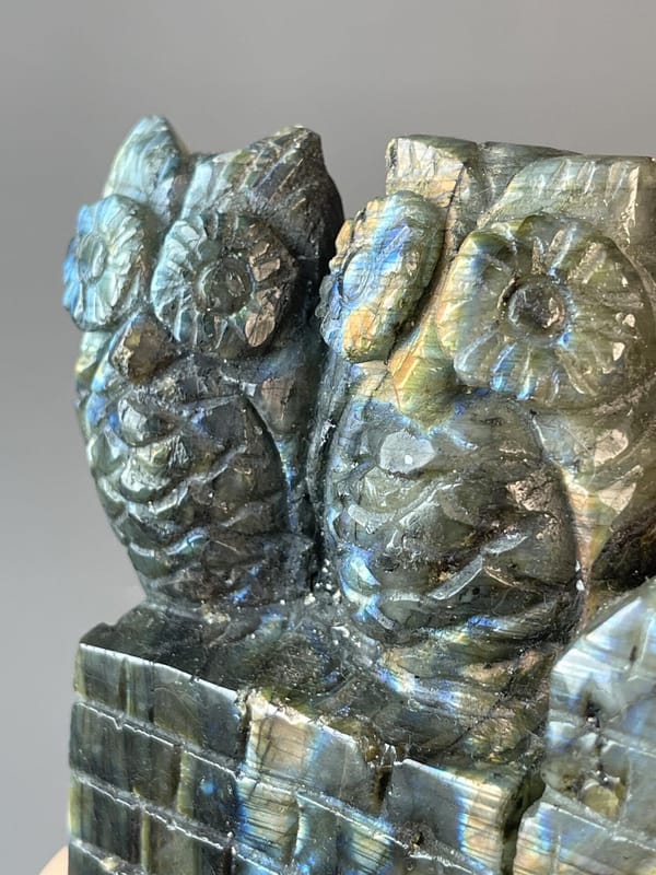 Labradorite owl showing spectral colour shift from different angles