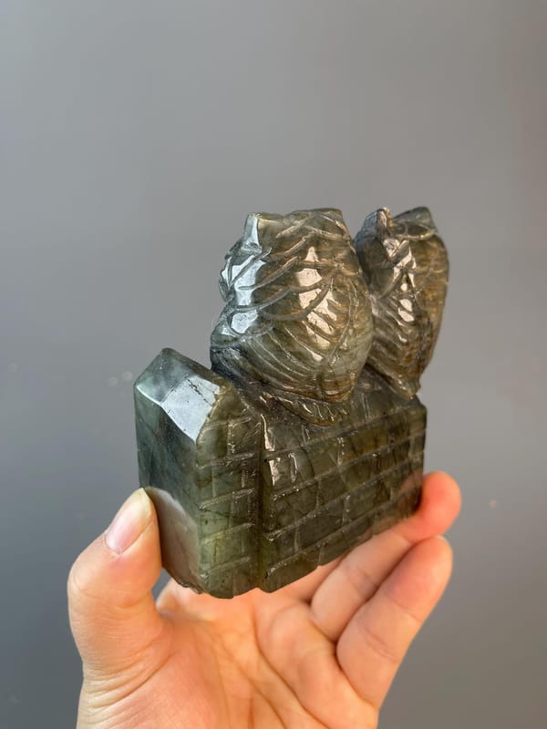 Angled view of labradorite owl showing full iridescence