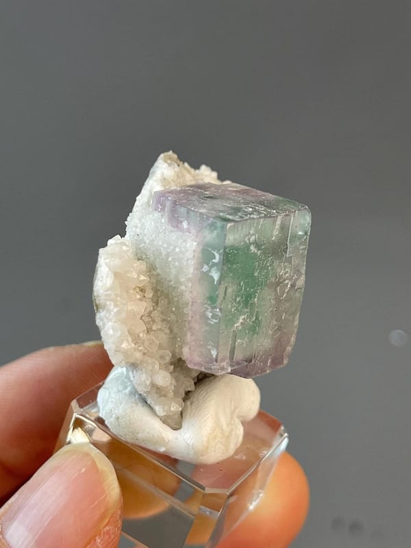 Scale view of 1.8x1.0x1.6 in purple fluorite cube