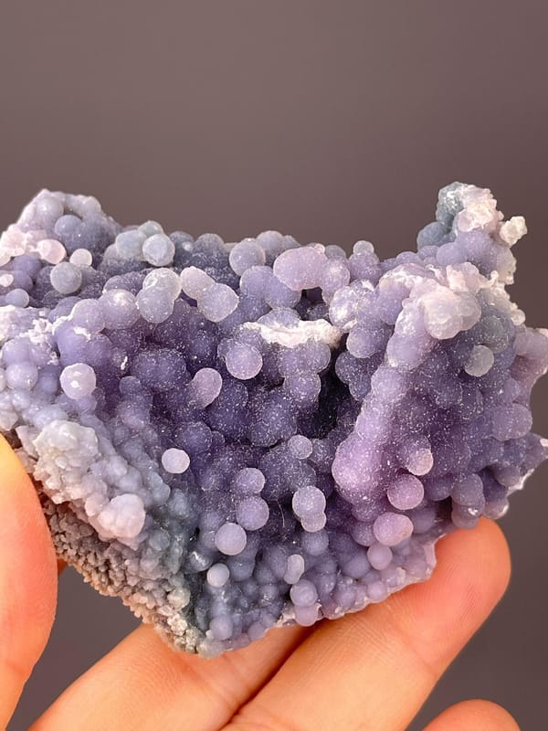 Close-up of silky starlight shimmer on grape agate spheres