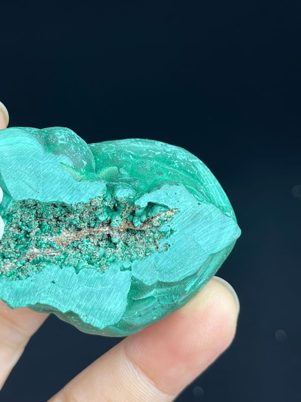 Contrasting polished and raw surfaces of Congo malachite