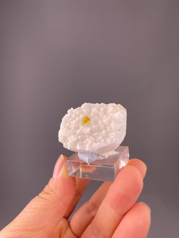 Close-up of yellow barite crystal faces on quartz
