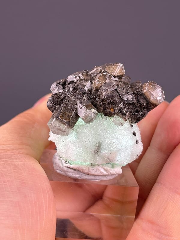 White calcite associated with green fluorite crystals