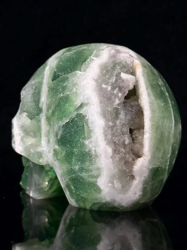 Green and white fluorite coloration on skull carving