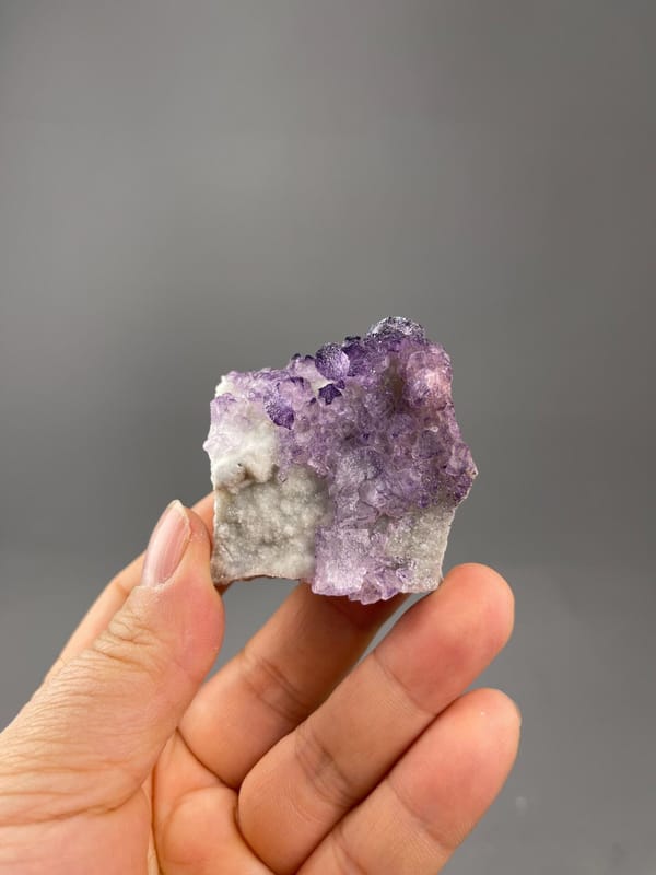 Purple fluorite pattern cluster side profile