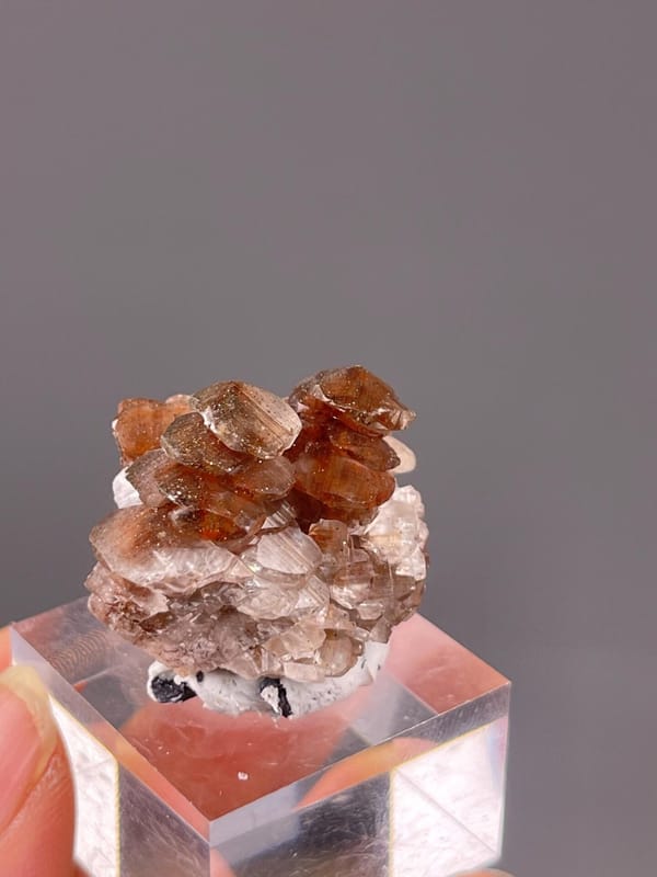 Full red calcite specimen on white background