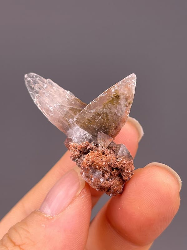 Full twin calcite specimen on white background