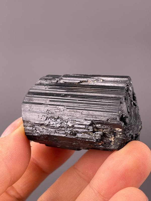 Natural raw crystal surface of schorl tourmaline