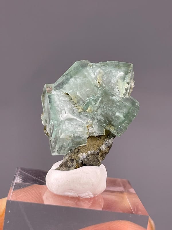 Translucent green fluorite under studio lighting
