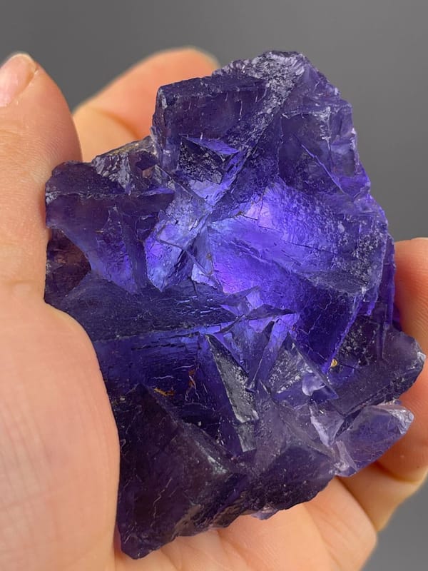 Back view of purple fluorite cluster base
