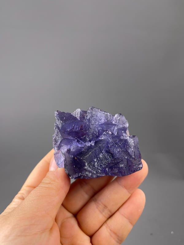 Vitreous luster on deep purple fluorite faces