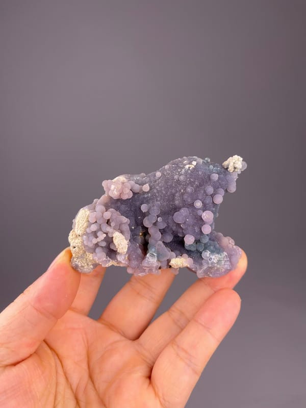 Close-up of round lavender grape agate formations