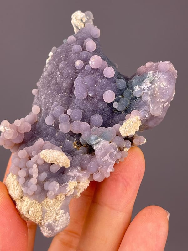 Back view of grape agate cluster base