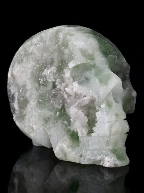 Side view of green fluorite skull, 3.5×2×3 in, China